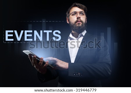 Businessman holding a tablet pc with "Events" text on virtual screen.