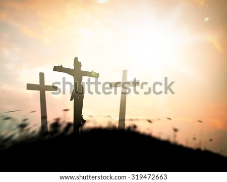 Good Friday concept: Silhouette three crosses on sunset background