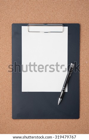 Blank Paper clipboard on cork board  for text and background