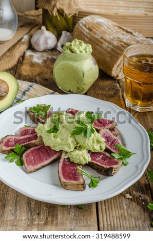 Beef steak with avocado dip and herbs, very simple very healthy recepy, rustic picture
