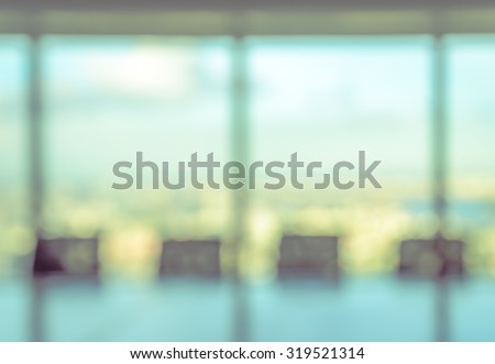 Blur image of empty boardroom with window cityscape background. Business concept Royalty-Free Stock Photo #319521314