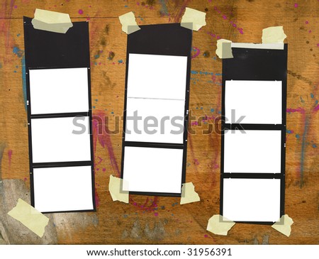 Printed medium format film strips, against grungy background, empty frames, free picture or copy space