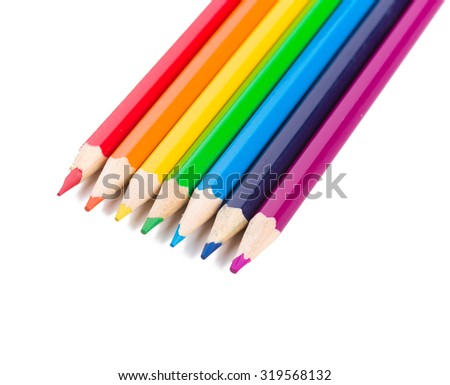 Many different colored pencils on white background.
