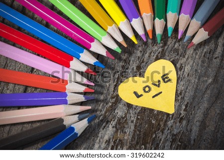 Colorful pencil on wood background