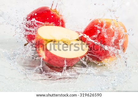 Fresh apples with splashing water. Royalty-Free Stock Photo #319626590
