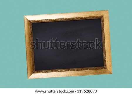 Chalkboard in vintage frame on blue background