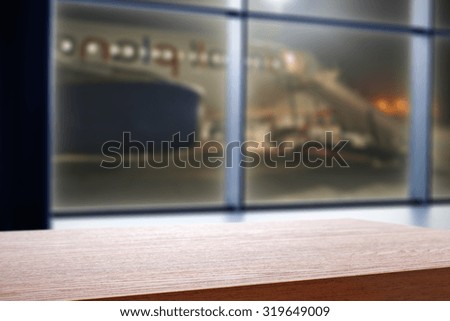 blurred night background of window on airport and board place 