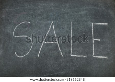 Sale and gift  Coupon voucher on black board.