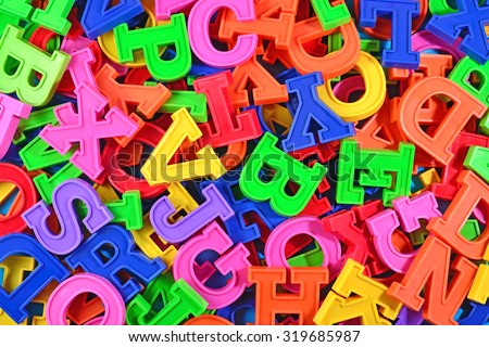 Colorful plastic alphabet letters as background texture