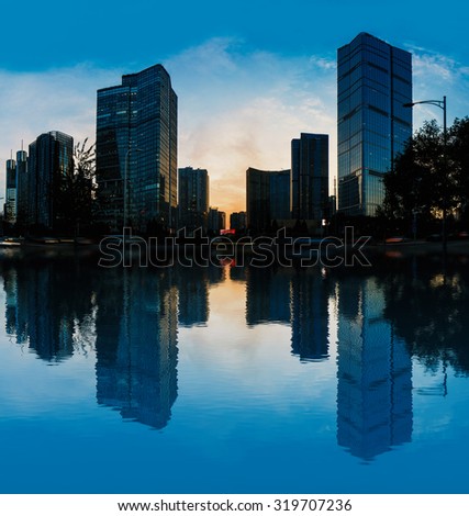 Beijing skyline panorama at night over lake with refelctions