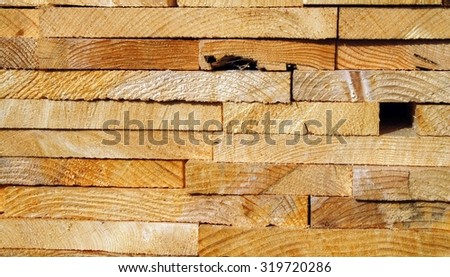Timber in a pile on the landing.