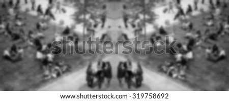 People crowd symmetric background, intentionally blurred post production.