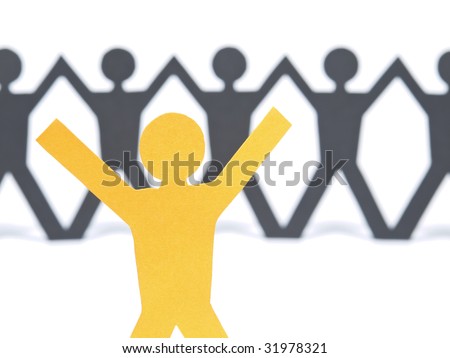 A yellow paper figure raising his arms. A paper man chain against the white background. Selective focus on the foreground.
