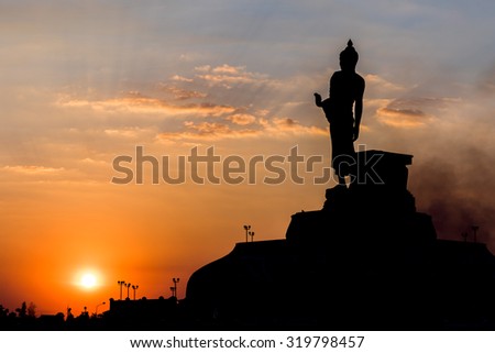 Big buddha statue in sunset background