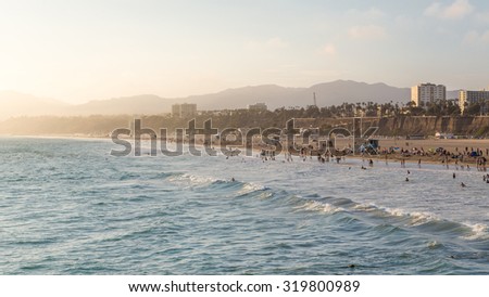 Sunset view with silky sky and golden beach of California, Santa Monica. A summer day

