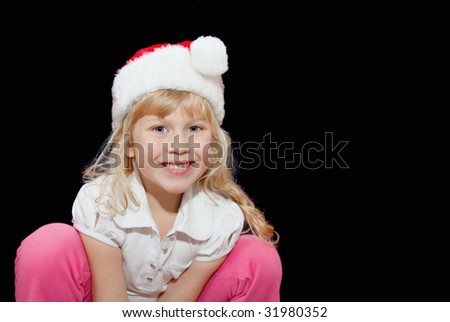 Beautiful little girl with blond hair and a bright smile.