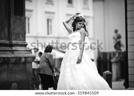 elegant gorgeous happy bride standing on the background of a old building in Lviv