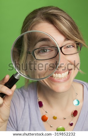 Woman with Magnifying Glass