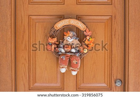 Fall harvest greetings wreath hanging on an exterior home door