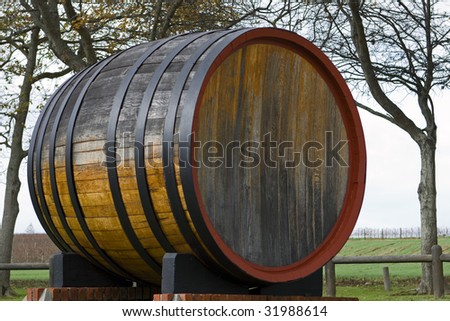 Oak wine barrel on Groot Constantia, a wine farm in Cape Town, South Africa. Royalty-Free Stock Photo #31988614