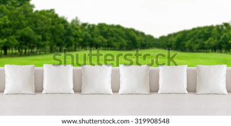 White and sofa on green background.