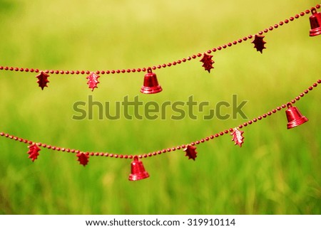 red bell/I hung Christmas ornament to grass.