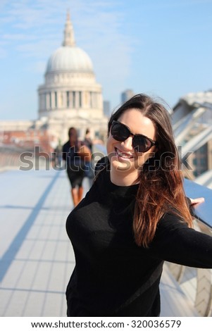 Girl Tourist in Front of St Paul's Cathedral, London, England.