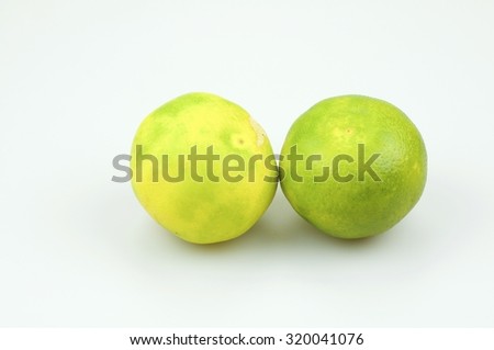 green tangerine, mandarin on the white backgound with copyspace