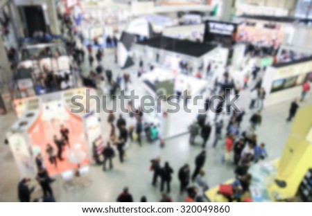 Trade show view, generic background, intentionally blurred post production. Royalty-Free Stock Photo #320049860