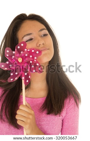 Beautiful Latino teen girl holding toy windmill