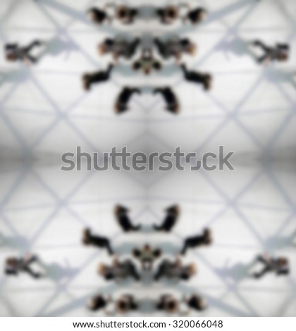 Geometric background with people silhouettes, intentionally blurred post production.
