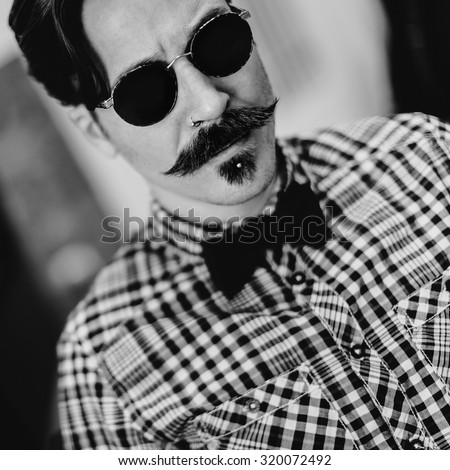 Stylish Retro man with fashionable haircut and mustache.