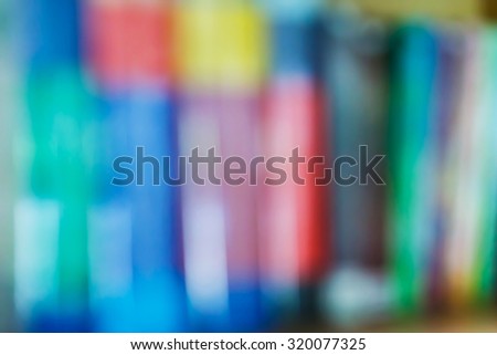Abstract blurred books on shelf, education concept