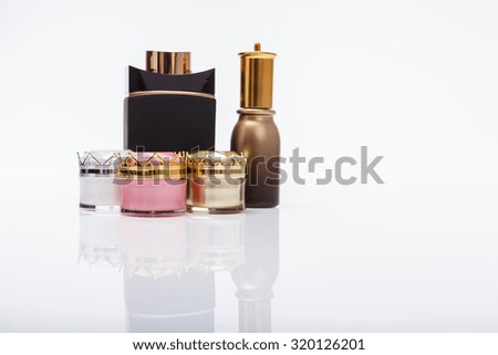 luxury cosmetic for men and women photo reflective white background
