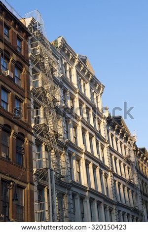 Golden hour view of traditional downtown New York City architecture in the SoHo cast iron historical district