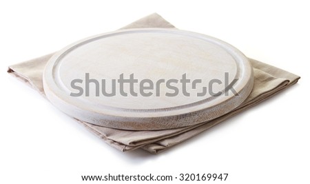 Beige cotton napkin under a white cutting board isolated on white background Royalty-Free Stock Photo #320169947