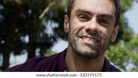 Portrait of young caucasian white male at the park