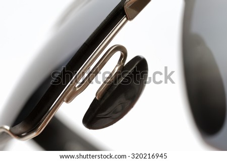 Fragment of sunglasses on a white background