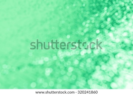 green background with bokeh.