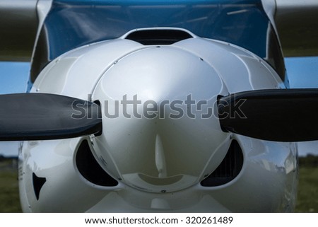 Color picture of a single-engine airplane - front view