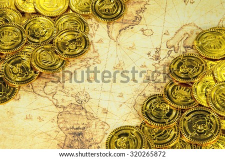 pirate golden coin on a old world map