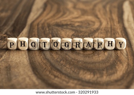 PHOTOGRAPHY word background on wood blocks