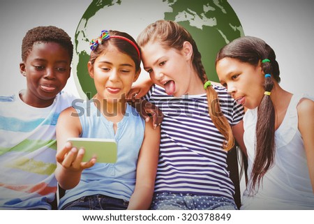 Happy children taking selfie at park against white background with vignette