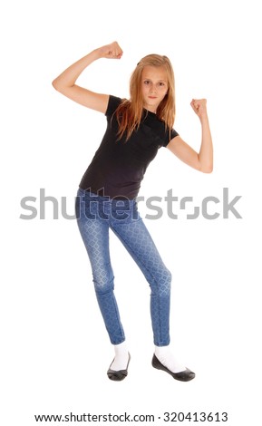 A beautiful blond girl in a black t-shirt and blue long pants dancing,
isolated for white background.
