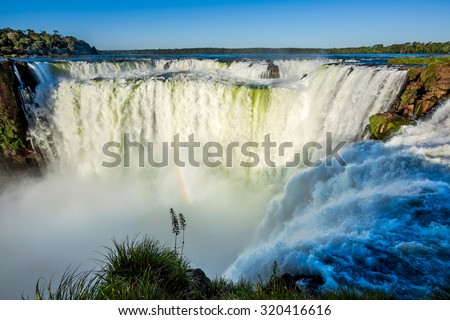 Devil's Throat at Iguazu Falls, one of the world's great natural wonders, on the border of Argentina and Brazil. Royalty-Free Stock Photo #320416616