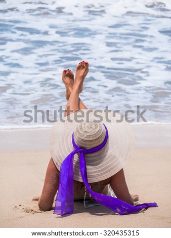 girl lying on the tropical  beach