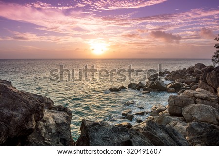Sunset between the beaches Anse Kerlan and Petite Anse Kerlan in Praslin Island, Seychelles.