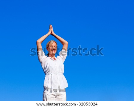 Young woman practising meditation outdoors