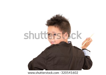 Little boy backwards, looking to the camera, drawing in the air, isolated over white background.