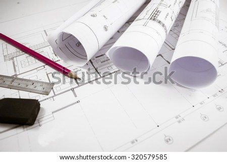 Architectural project,Architecture  plans,Architecture  plans on desk. Royalty-Free Stock Photo #320579585
